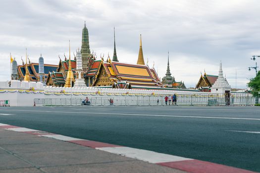 Wat Phra Kaew on cloudy day. The place is regarded as the most sacred Buddhist temple in Thailand. There is the Emerald Buddha housed in temple. Tourist destination
