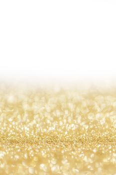 Shiny golden bokeh glitter lights abstract background, Christmas New Year party celebration concept