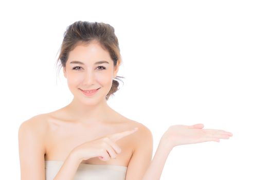 Asian beautiful young woman showing with healthy clean skin presenting something on the hand isolated on white background, beauty of girl with skincare and cosmetic concept.