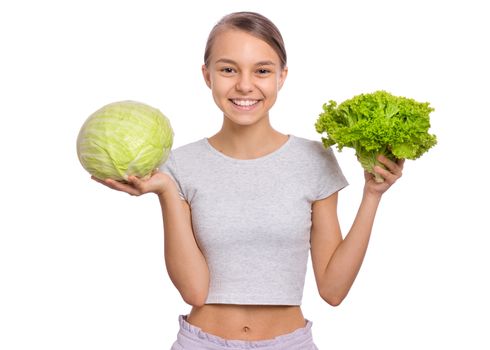 Beautiful young teen girl holding fresh green cabbage, isolated on white background