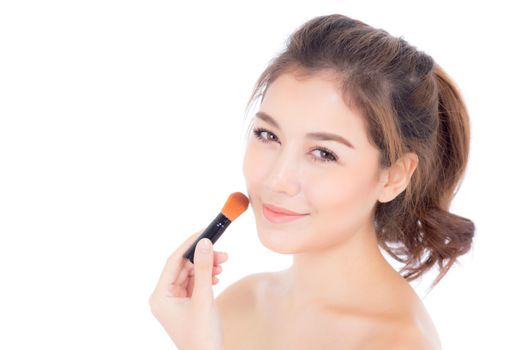 Beauty asian woman applying make up with brush of cheek isolated on white background, beautiful of girl holding blusher, skincare and cosmetic concept.