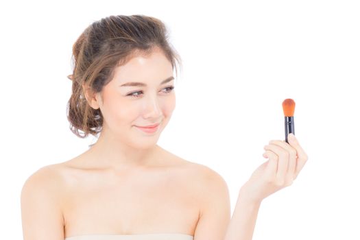 Beauty asian woman applying make up with brush of cheek isolated on white background, beautiful of girl holding blusher, skincare and cosmetic concept.