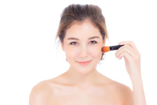 Beauty asian woman applying make up with brush of cheek isolated on white background, beautiful of girl holding blusher, skincare and cosmetic concept.