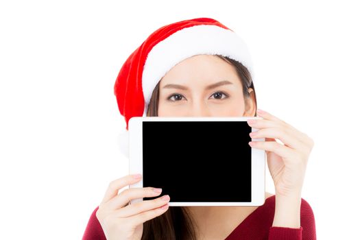 Asian young woman wear santa hat with digital tablet empty space, Beautiful girl showing tablet with season merry christmas and happy new year holiday, shopping online concept.