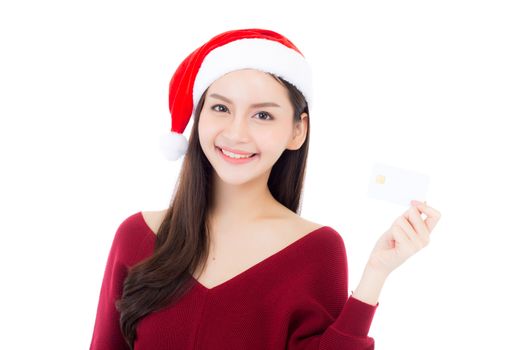 Portrait of beautiful asian young woman in santa hat smile holding credit card, girl have happy with shopping isolated on white background, christmas and holiday concept.