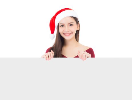 Portrait of beautiful christmas asian young woman in santa hat holding board with copyspace empty isolated on white background, xmas holiday concept.
