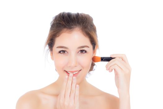 Beauty asian woman applying make up with brush of cheek isolated on white background, beautiful of girl holding blusher, skincare and cosmetic concept.