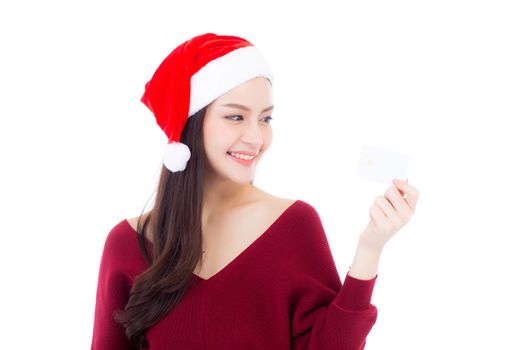Portrait of beautiful asian young woman in santa hat smile holding credit card, girl have happy with shopping isolated on white background, christmas and holiday concept.