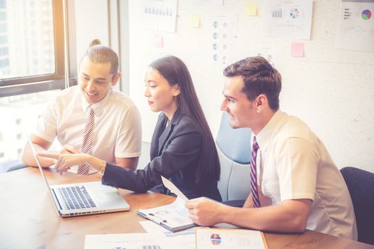 Business team having a meeting using laptop during a meeting and presents profit, Present report analysis and planning with brainstorm in teamwork.