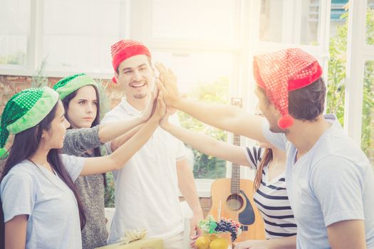 Asian group people man and woman giving gift box and celebration at party outdoor. group of friends social event with birthday achievement, success festive concept.