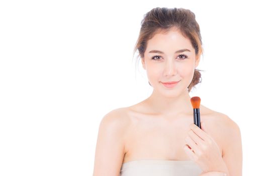 Beauty asian woman applying make up with brush of cheek isolated on white background, beautiful of girl holding blusher, skincare and cosmetic concept.