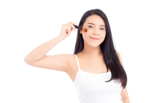 Beauty asian woman applying make up with brush of cheek isolated on white background, beautiful of girl holding blusher, skincare and cosmetic concept.