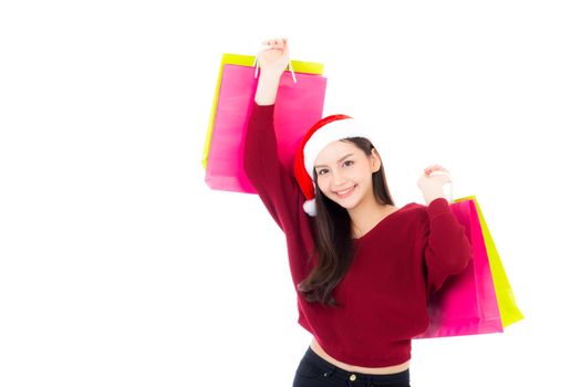 Happy fashion asian woman with smile holding shopping paper bag, Sale and christmas with holiday, girl with buyer enjoy and excited isolated on white background, holiday concept.