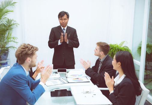 business people clapping around of coworker conference in meeting room with congratulation success of teamwork, corporate with successful concept.