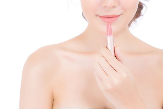 Beauty asian woman applying make up with lipstick of mouth isolated on white background, Beautiful girl on lips with happy, skincare and cosmetic concept.