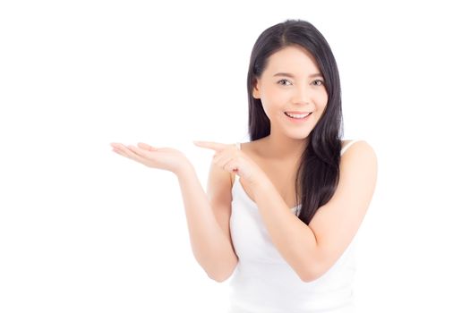 Portrait of beautiful asian woman makeup of cosmetic, girl hand pointing something and smile attractive, face of beauty perfect with wellness isolated on white background with skin healthcare concept.