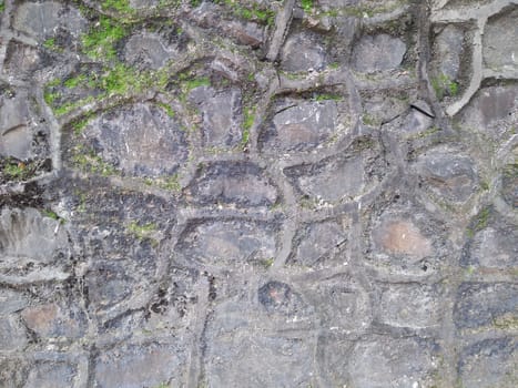 exterior old stone wall with cement pattern.