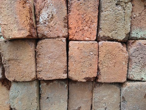 dry red clay bricks for building construction work . with put