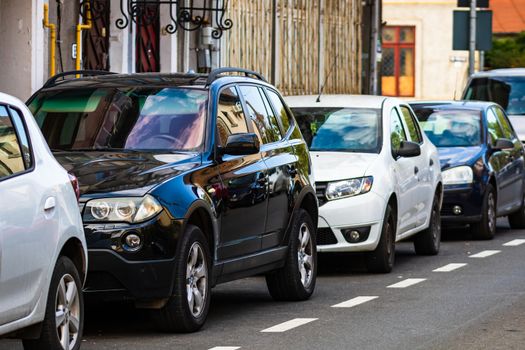 Parked cars along a street in Bucharest, Romania, 2020.