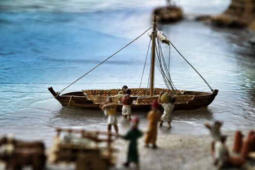 Cartagena, Murcia, Spain- July 27, 2019: Miniature roman figurines displayed in a Cartagena Museum reflecting daily life in roman times