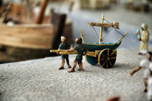 Cartagena, Murcia, Spain- July 27, 2019: Miniature roman figurines displayed in a Cartagena Museum reflecting daily life in roman times