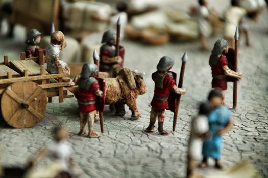 Cartagena, Murcia, Spain- July 27, 2019: Miniature roman figurines displayed in a Cartagena Museum reflecting daily life in roman times
