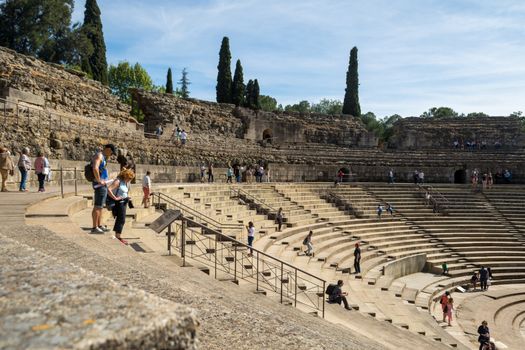 Merida, Spain, April 2017, tourists visiting the Roman ruins theatre arena & waiting rooms used for gladiator & animal fights. Travel and tourism.