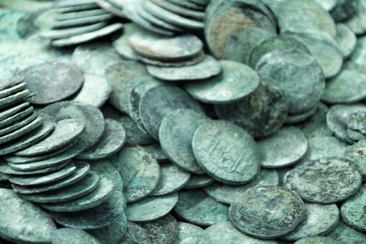 Cartagena, Murcia, Spain- July 25, 2019: Spanish silver coins recovered from the ocean floor by the Odissey company and exposed in underwater museum in Cartagena, Spain