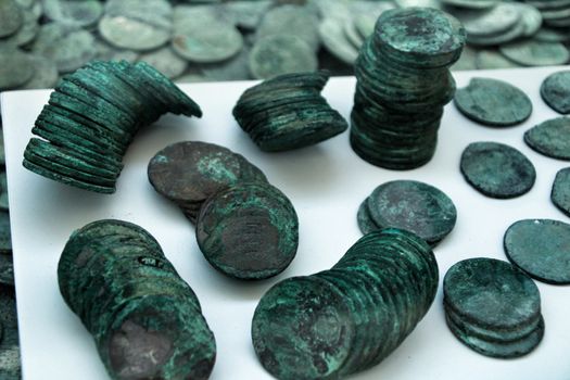 Cartagena, Murcia, Spain- July 25, 2019: Spanish silver coins recovered from the ocean floor by the Odissey company and exposed in underwater museum in Cartagena, Spain