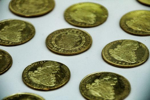 Cartagena, Murcia, Spain- July 25, 2019: Spanish gold coins recovered from the ocean floor by the Odissey company and exposed in underwater museum in Cartagena, Spain