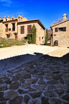 Riopar Viejo, Albacete, Spain- February 8, 2019: Old beautiful stone facades and streets in Riopar Viejo village, Castilla La Mancha, Spain. Sunny day of winter.