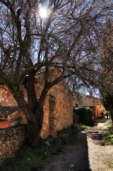 Riopar Viejo, Albacete, Spain- February 8, 2019: Old beautiful stone facades and streets in Riopar Viejo village, Castilla La Mancha, Spain. Sunny day of winter.