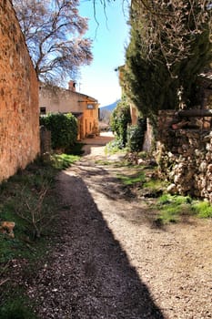 Riopar Viejo, Albacete, Spain- February 8, 2019: Old beautiful stone facades and streets in Riopar Viejo village, Castilla La Mancha, Spain. Sunny day of winter.