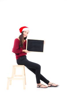 Beautiful young asian woman showing chalkboard with presentation isolated on white background, girl holding blackboard for education, christmas and holiday concept.