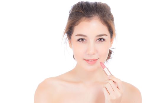 Beauty asian woman applying make up with lipstick of mouth isolated on white background, Beautiful girl on lips with happy, skincare and cosmetic concept.
