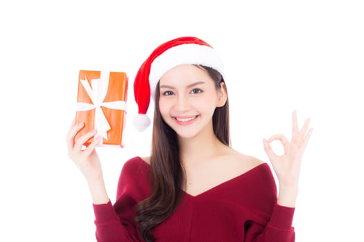 Happy asian woman with smile holding gift box many of xmas, Present girl sign ok with celebration christmas a holiday, girl with buyer isolated on white background.