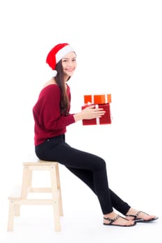 Happy asian woman sitting with smile holding gift box many of xmas, Present girl with celebration christmas a holiday, girl with buyer isolated on white background, shopping concept.