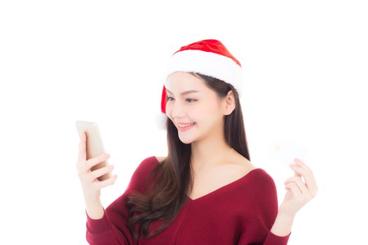Beautiful asian young woman shopping with credit card and holding mobile phone in christmas holiday, girl with payment isolated on white background.
