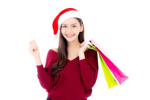 Happy fashion asian woman with smile holding shopping paper bag and credit card, Sale and christmas with holiday, girl with buyer enjoy and excited isolated on white background, season concept.