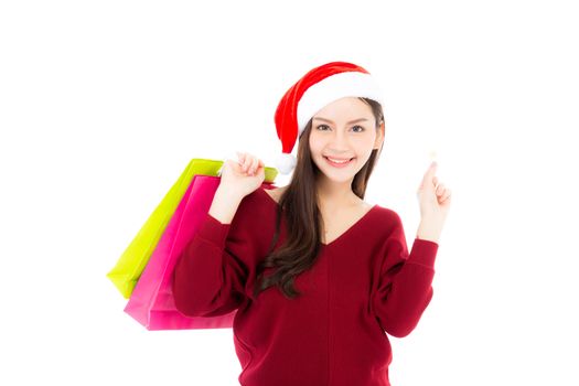 Happy fashion asian woman with smile holding shopping paper bag and credit card, Sale and christmas with holiday, girl with buyer enjoy and excited isolated on white background, season concept.