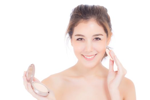 Portrait of beautiful asian woman applying powder puff at cheek makeup of cosmetic, beauty of girl with face smile isolated on white background, wellness and healthcare concept.