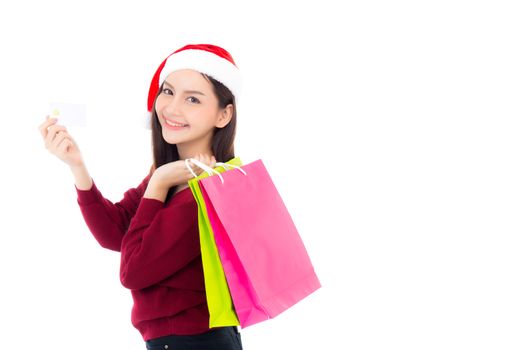 Happy fashion asian woman with smile holding shopping paper bag and credit card, Sale and christmas with holiday, girl with buyer enjoy and excited isolated on white background, season concept.