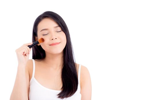 Beauty asian woman applying make up with brush of cheek isolated on white background, beautiful of girl holding blusher, skincare and cosmetic concept.