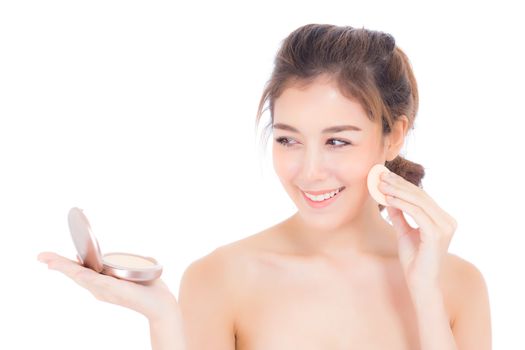 Portrait of beautiful asian woman applying powder puff at cheek makeup of cosmetic, beauty of girl with face smile isolated on white background, wellness and healthcare concept.