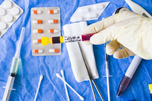 Corona virus negative blood test tubes on the white background, studio shoot. Blood test samples. Diagnosis and laboratory.