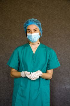 Woman doctors portrait, doctors with mask, glove and uniform. Uniform for surgery and viruses.