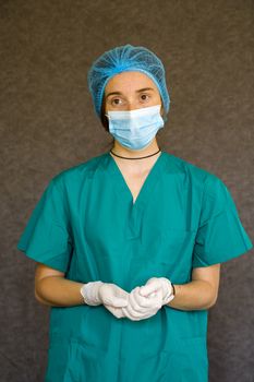 Woman doctors portrait, doctors with mask, glove and uniform. Uniform for surgery and viruses.