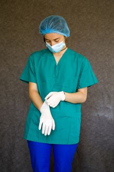 Woman doctors portrait, doctors with mask, glove and uniform. Uniform for surgery and viruses.