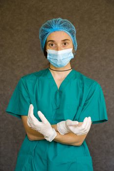 Woman doctors portrait, doctors with mask, glove and uniform. Uniform for surgery and viruses.