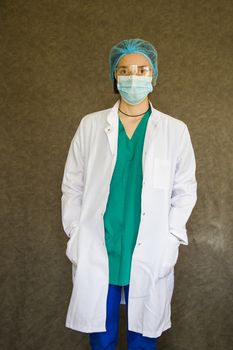 Woman doctors portrait, doctors with mask, glasses, glove and uniform. Uniform for surgery and pandemic.